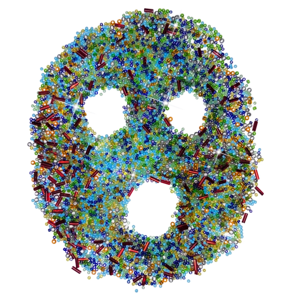 An image of beads arranged to form a face.